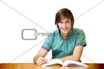 Student sitting in library reading