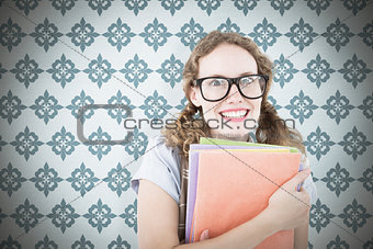 Composite image of geeky hipster woman holding files