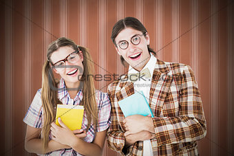 Composite image of geeky hipsters smiling at camera