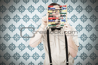 Composite image of geeky hipster holding an abacus
