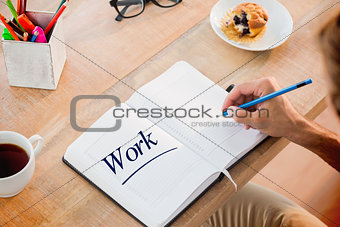 Work  against man writing notes on diary