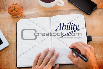 Ability against man writing notes on diary