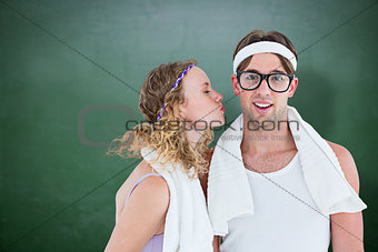 Composite image of geeky hipster kissing her boyfriend