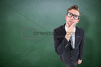 Composite image of thoughtful geeky hipster businessman looking up