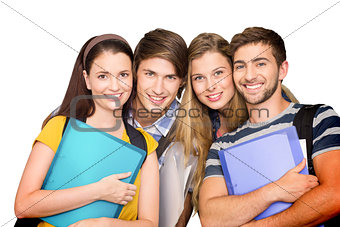 Composite image of happy students holding folders at college corridor