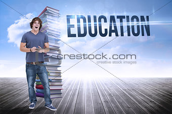 Education against stack of books against sky