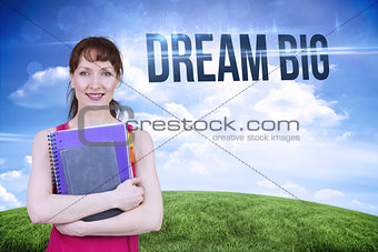 Dream big against green hill under blue sky