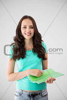 Composite image of portrait of smiling young woman with file