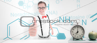 Composite image of geeky young hipster showing thumbs up