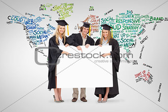 Composite image of three students in graduate robe holding and pointing a blank sign