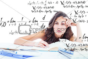 Composite image of bored student doing her homework