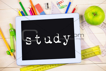 Study against students table with school supplies