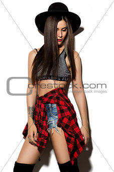 Beautiful young woman with long hair posing on wight background.