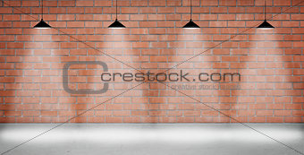 Brown brick wall lightened with four lamps