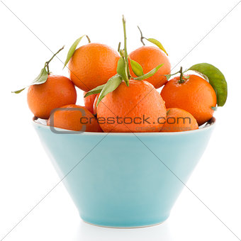 Tangerines on ceramic blue bowl 