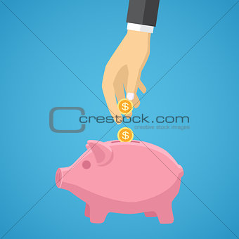 hand saving money in piggy bank