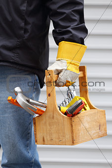 worker holding toolbox