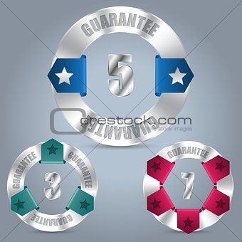 Metallic guarantee badge set with color ribbons