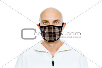 Bald, man in a white jacket and mask. Studio. isolated