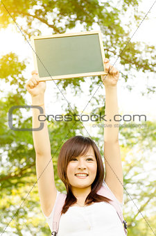  Asian college girl student with blank chalkboard