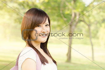 Young Asian girl student smiling