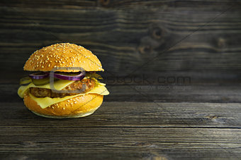 The concept of fast food. Burger on a wooden board. White background
