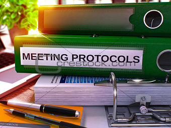 Meeting Protocols on Green Ring Binder. Blurred, Toned Image.