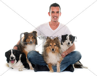 four beautiful dogs and man