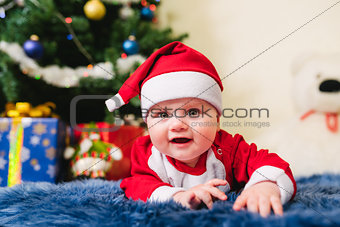 Baby dressed in Santa Claus