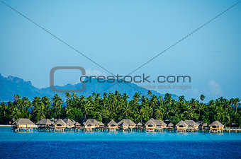 Overwater bungalows with view of amazing blue lagoon