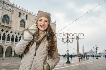 Smiling young woman tourist on St. Mark's Square, Venice