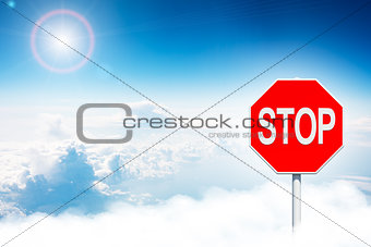 Road sign stop in clouds
