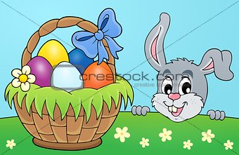 Decorative egg basket and lurking bunny