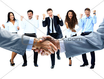 handshake on a background of a happy group of people