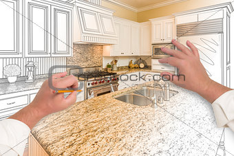 Male Hands Sketching Custom Kitchen with Photo Showing Through