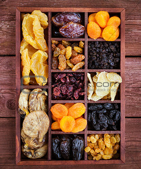 Ðssorted dried fruits in wooden box
