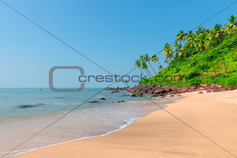calm ocean and fine sand on the shore