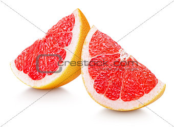 Slices of grapefruit citrus fruit isolated on white