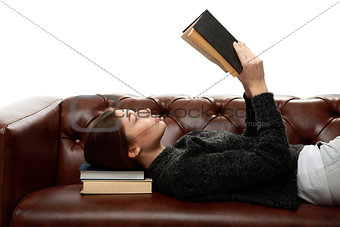 young woman lying on the couch with books under his head