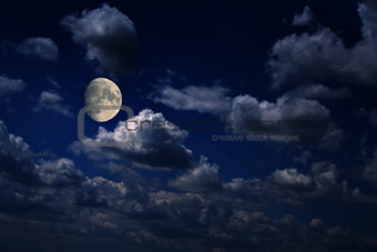 Moon over scattered clouds