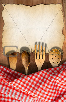 Kitchen Utensils on Wooden Table with Tablecloth