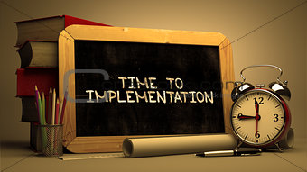 Time to Implementation Handwritten by white Chalk on a Blackboard