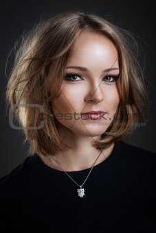 Portrait of beautiful young woman wiht wild hair