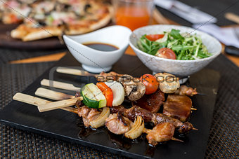 Assorted meat on skewers in  restaurant