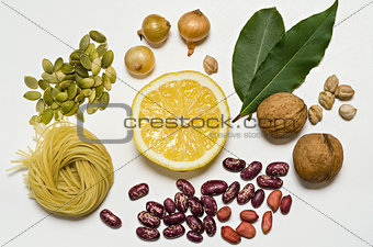 Pasta and spices lie groups on a white background