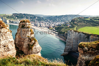 View from the famous white cliffs of Ãtretat on the beach and th