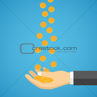Gold coins fall into the hand.