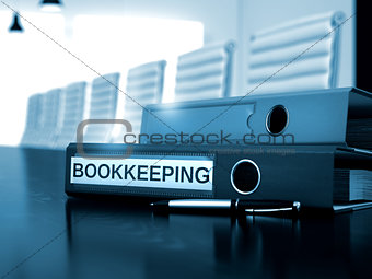 Bookkeeping on Office Folder. Toned Image.