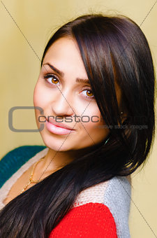 Smiling beautiful brunette woman with long hair