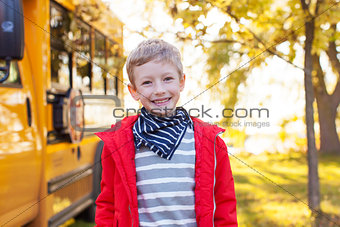 boy near schoolbus